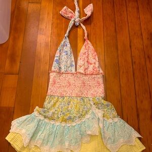 Sundress. Beautiful floral with a halter top that ties in the back.